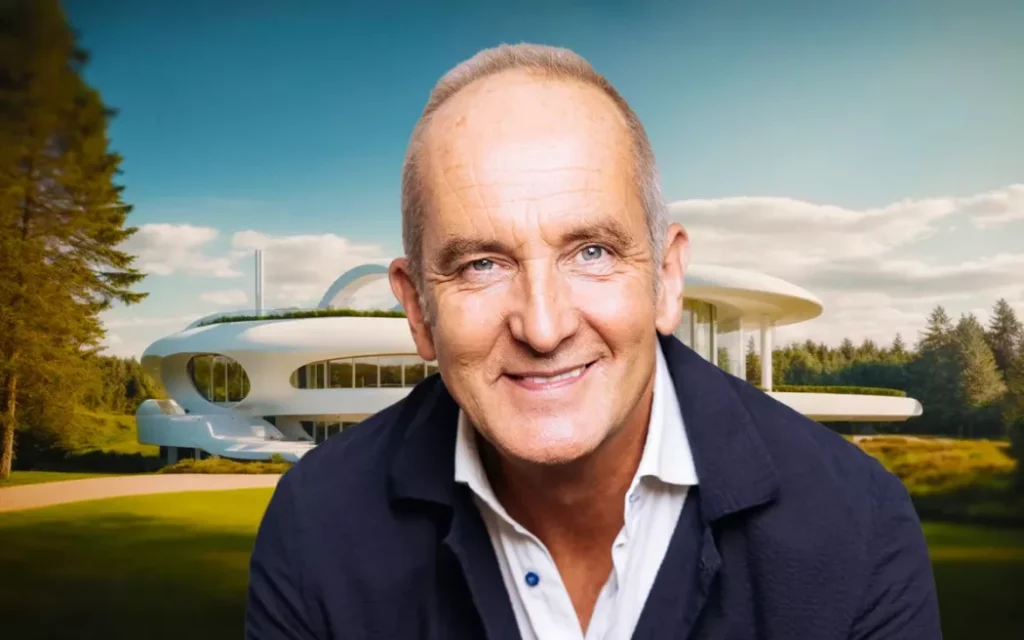 Kevin McCloud in front of futuristic house