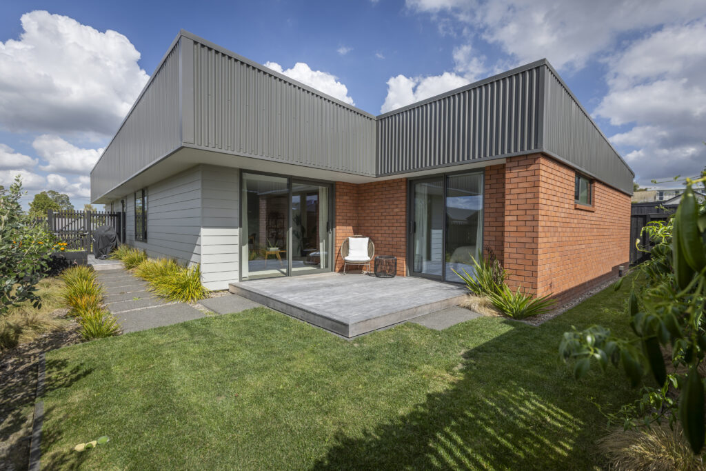 Overlooking lawn at deck and house exterior